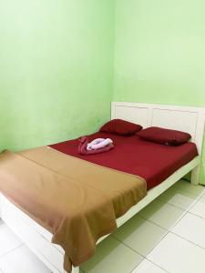 Ένα ή περισσότερα κρεβάτια σε δωμάτιο στο Zella Kost & Homestay