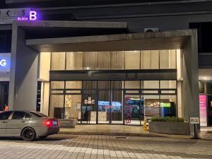 a car parked in front of a building at Wonderful Geo Bukit Rimau Condominium in Shah Alam