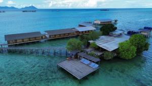 an island in the water with a train on it at Nusakuya Resort in Semporna