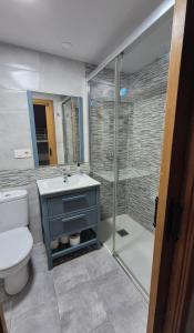 a bathroom with a toilet and a sink and a shower at La Molnera in La Molina +26 photos