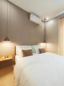 Postel nebo postele na pokoji v ubytování The Palm House