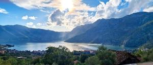 a view of a lake in the middle of mountains at Tamaris apartments Risan in Risan