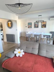 a living room with a couch and a table at Villa Eden in Latour-Bas-Elne