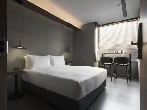 Ένα ή περισσότερα κρεβάτια σε δωμάτιο στο Miu Hostel +17 φωτογραφίες