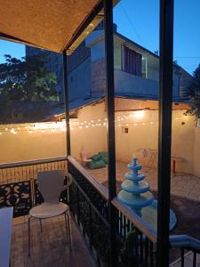 a view of a balcony with a table and chairs at Nuryan Garden Hostel in Yerevan