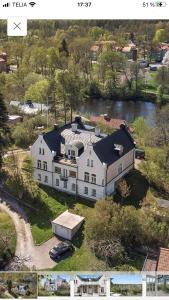 an aerial view of a large white house at Rosa Villan Högsby in Högsby