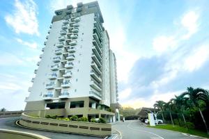 a building with balconies on the side of a road at Luxury Cozy Apartment - Fairway Galle in Galle