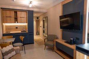 a room with a living room with a tv at Sea Star Apartments in Ulcinj