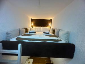 a bedroom with a large bed in a room at Villa Komorebi, the Private 3BR Grand Estate - 2500m2 Garden - Walk to Beach & Town in Ierapetra +38 photos