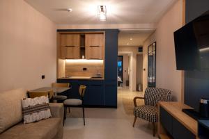 a living room with a couch and a dining room at Sea Star Apartments in Ulcinj