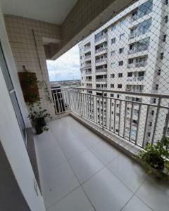 a balcony with a view of a building at COP 30 Apartamento Luxo - 3 Quartos, Piscina, Academia, Area de Lazer in Belém