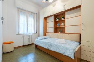 a small bedroom with a bed and a window at Vintage al passetto - Ancona Centro in Ancona