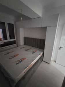 Ένα ή περισσότερα κρεβάτια σε δωμάτιο στο Struga Sunset