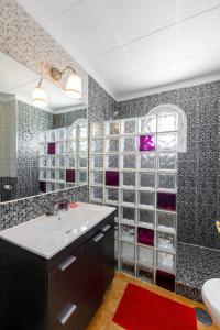 a bathroom with a sink and a toilet in it at The Colors House, 513 nice and cosy in Costa Teguise +63 photos