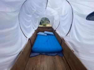 a tent with a blue mattress in the inside of it at O.k. Corral in Misano Adriatico