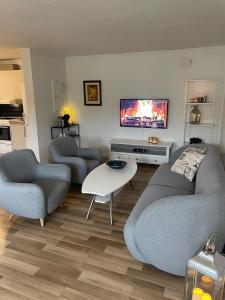 Et opholdsområde på Apartment Mandal + 12 billeder