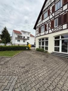 a brick driveway in front of a building at Charmantes Apartment in Dettingen an der Erms in Dettingen an der Erms