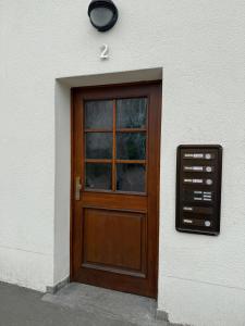 a wooden door on the side of a building at Charmantes Apartment in Dettingen an der Erms in Dettingen an der Erms