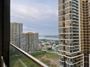 a view from the balcony of a tall building at HOMESTAY ADORA in Long Bình