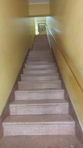 a set of stairs in a building at Casa da iluminada in Belém
