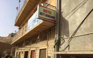 a sign on the side of a building at Hotel akty Jaisalmer in Jaisalmer