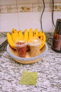 a plate of bananas and other food on a counter at SkyNest 2BR Modern Apt Unit in Soroti