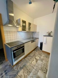 a kitchen with a sink and a stove top oven at Aurelia in Sulzbach-Rosenberg