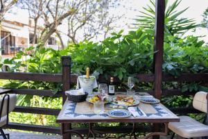a table with plates of food on a patio at Boutique Hotel Las Islas in Fuengirola