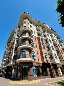 a tall building with balconies on the side of it at «Перлина Умані» апартаменти in Umanʼ +10 photos
