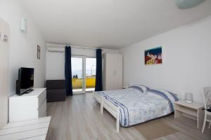 Posteľ alebo postele v izbe v ubytovaní Apartmani Ve-Ro