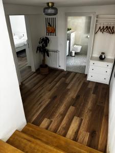 a hallway with a wooden floor and a mirror at Kraljev Vrh Apartments in Kraljev Vrh +24 photos