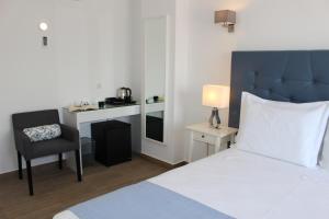 A bed or beds in a room at River Inn - Duna Parque Group