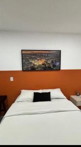 Ένα ή περισσότερα κρεβάτια σε δωμάτιο στο Novo centro Apt 102 +5 φωτογραφίες