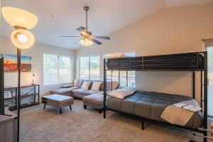 a bedroom with a bunk bed and a couch at NEW Desert Daze, near Golf, Heated Pool+Spa, 12ppl in Scottsdale +67 photos