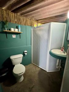 a bathroom with a toilet and a sink at Refugio del Cielo # in Sayulita +66 photos