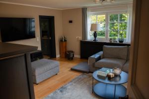 a living room with a couch and a table at Ferienhaus Hallmanns Hof in Schmallenberg