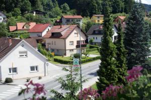 a village with houses and a street with a road at Guest house Bohorč in Šentjur