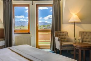 Postel nebo postele na pokoji v ubytování Hotel REDYK Ski&Relax + 37 fotografií