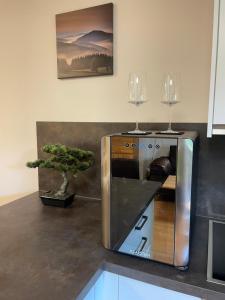a microwave sitting on a kitchen counter with a tree at Stylische Ferienwohnung Casagrande mit Vollausstattung in Zwiesel