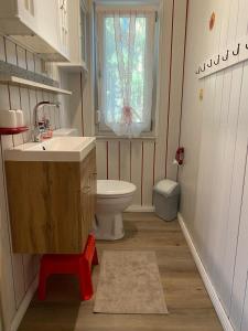 a bathroom with a sink and a toilet and a window at Ferienhaus am Wald in Friedrichroda +10 photos