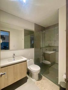 a bathroom with a toilet and a sink and a shower at Boutique hotel experience in Bogotá