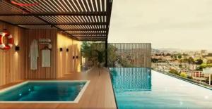 a swimming pool on the side of a building at Boutique hotel experience in Bogotá