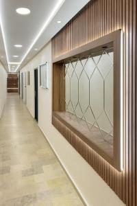a hallway with a glass display on the wall at Appartement sur tanger - pour vacance in Tangier