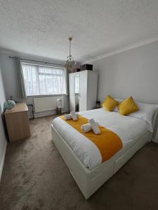 a bedroom with a large bed with towels on it at Stylish 2 Bedroom Apartment in Belvedere