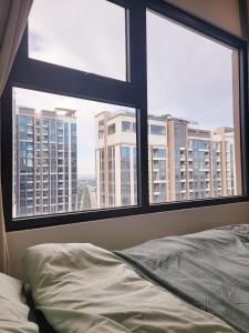 Katil atau katil-katil dalam bilik di Fristay Apartment Ocean Park +18 gambar