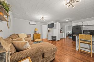 a living room with a couch and a table at Cozy Retreat on Lake Catherine in Hot Springs