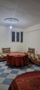 En eller flere senge i et værelse på Gite El Qalaa - مأوى القلعة