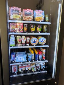 a refrigerator filled with lots of food and drinks at Les Marmottes in Montgenèvre