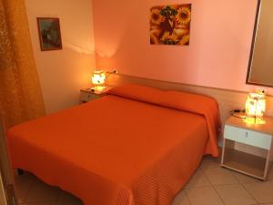 A bed or beds in a room at Villa Marilena