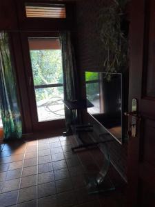 TV a/nebo společenská místnost v ubytování Appel Oase + 2 fotografie